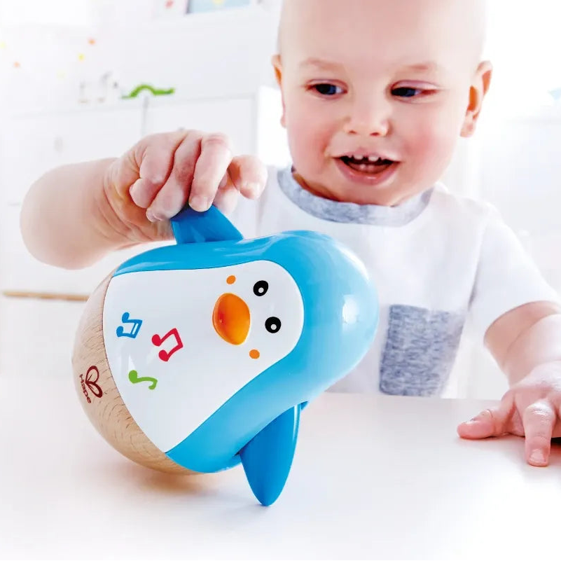 Pinguim Musical Sensorial Balançante Premium Com Movimento e Som Suave – Hape